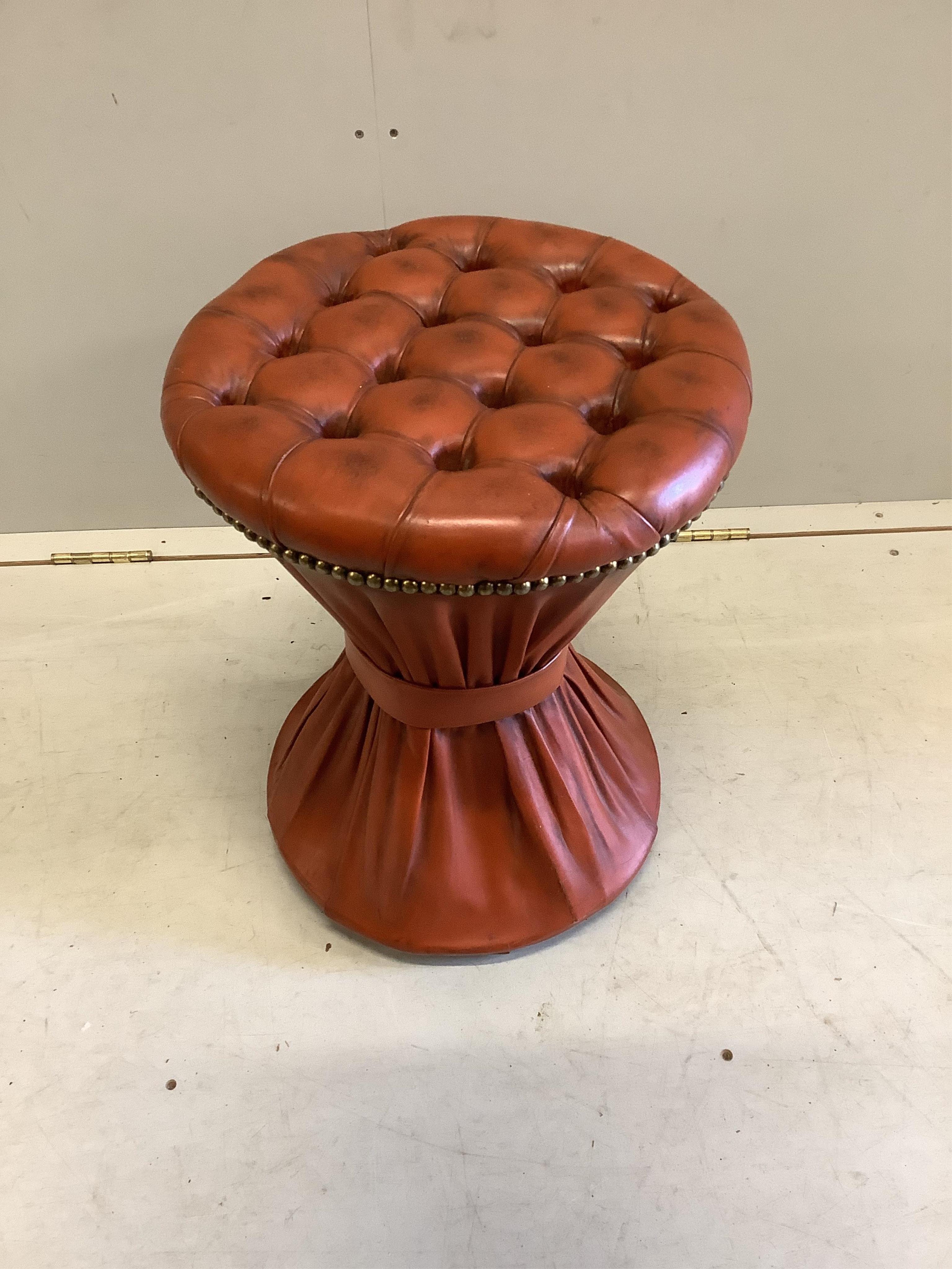 Two “book-stack” storage boxes, a ditto cabinet and a red leather brass studded circular stool, diameter 39cm, height 49cm